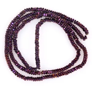 Close-up detail of 2x1mm metallic purple flat hematite disc beads for DIY jewelry making