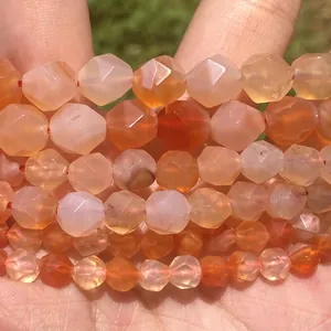 Macro view of multi-faceted pink quartz and chalcedony natural stone beads for DIY.