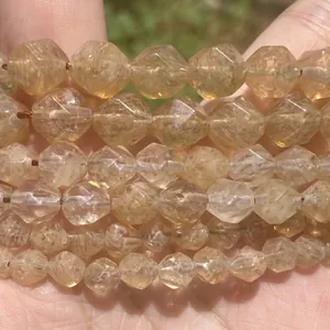 Macro view of multi-faceted yellow natural stone beads for DIY jewelry making accessories