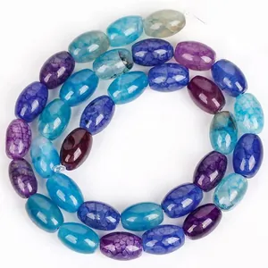 High-quality close-up of blue and purple dragon vein agate oval beads for DIY jewelry.