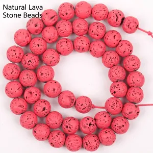 Close-up detail of rose red porous lava stone round beads for DIY jewelry making