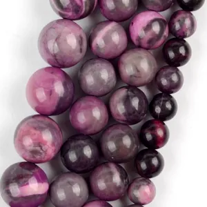 Close-up detail of rose red natural stone beads showing unique purple marbled textures