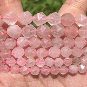 Close-up of faceted natural rose quartz beads with translucent pink finish for DIY
