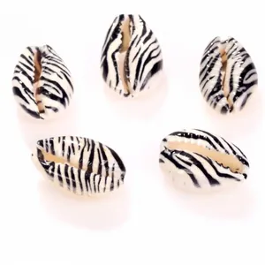 Detailed view of zebra print cowrie shell beads for DIY jewelry making accessories