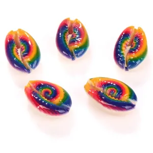 Detail view of rainbow printed natural cowrie shell beads for DIY jewelry making.