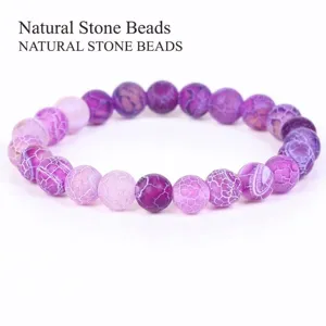Detail shot of purple dragon vein agate beads showing unique weathered texture.
