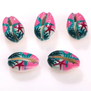 Macro view of printed cowrie shell beads featuring vibrant colorful starfish patterns