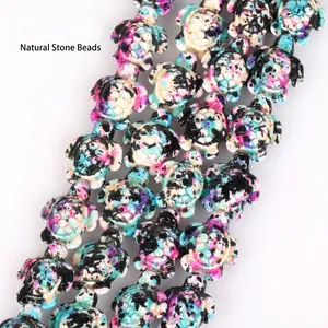 Close-up of colorful camouflage turtle-shaped synthetic turquoise beads for DIY jewelry