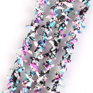 Detailed close-up of colorful camouflage starfish beads for DIY jewelry accessories.