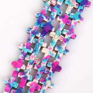 Detailed macro view of colorful camouflage turquoise cross-shaped DIY jewelry beads