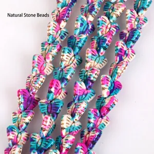 Close-up of vibrant camo butterfly turquoise stone beads for DIY jewelry making