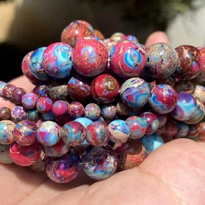 Detailed view of colorful natural imperial jasper round beads for DIY jewelry making