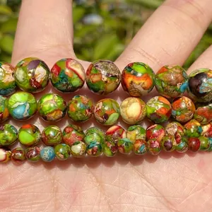 Strands of 4-10mm natural multi-color Imperial Jasper round beads for jewelry making.