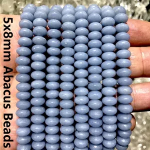 Macro view of blue angelite abacus beads sized 5x8mm for DIY jewelry making projects