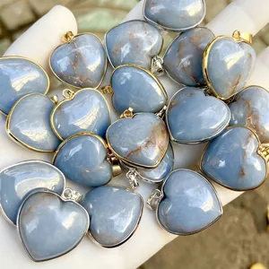 Close-up of natural blue angelite heart-shaped stone pendants with metal bails.