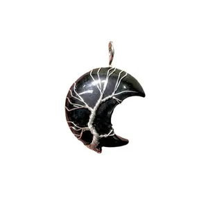 Handmade natural black stone crescent moon pendant with silver wire wrap tree of life design