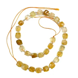 Natural faceted yellow crystal cube beads for DIY jewelry making accessories on white background