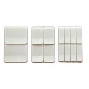 Detailed view of semi-transparent white index stickers in three different sizes