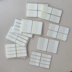Detail view of translucent white sticky index tabs in various sizes for stationery