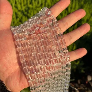 Close-up of high-quality natural clear Brazilian crystal barrel beads for DIY jewelry