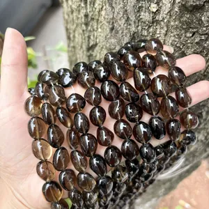 Close-up view of natural smoky quartz irregular tumble beads for DIY jewelry making