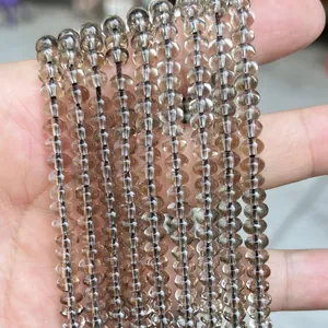 Vista detallada de cuentas de ábaco de cuarzo ahumado transparente para joyería DIY