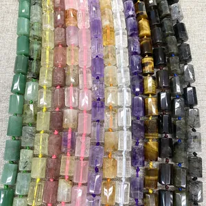 Close-up of assorted cylindrical natural crystal gemstone beads for DIY jewelry making