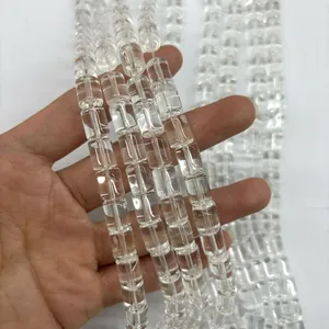 Close-up of transparent A-grade natural white crystal cylindrical loose beads for DIY.