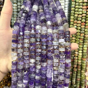 Close-up of faceted natural purple amethyst cylinder beads for handmade DIY jewelry making