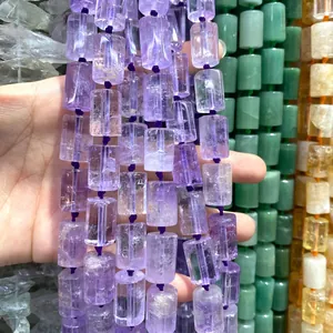 Close-up of 12x16mm faceted purple amethyst cylinder beads for DIY jewelry making