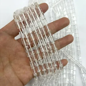 Macro view of clear Brazilian quartz cylindrical beads for DIY necklace and bracelet