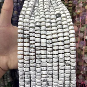 Macro detail of white marble patterned 6x10mm faceted abacus stone beads