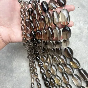 Detailed view of clear natural smoky quartz irregular oval beads for DIY jewelry