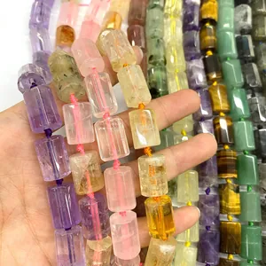 Macro view of colorful faceted cylindrical natural crystal beads for DIY jewelry making.