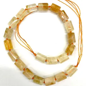 Natural yellow crystal cylinder beads 12x16mm for DIY jewelry, shown in a looped strand.