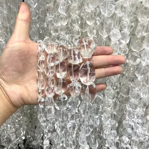 Close-up macro view of natural Brazilian clear quartz irregular nugget beads for DIY jewelry