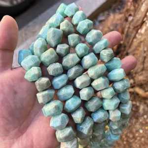 Close-up of natural faceted light blue Amazonite stone beads for DIY jewelry making.