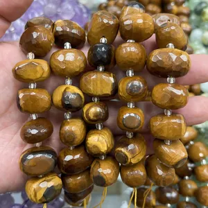 Macro view of faceted oval tiger-eye stone beads for DIY jewelry making