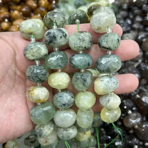 Macro detail of natural light green oval faceted crystal stone beads for DIY jewelry crafting