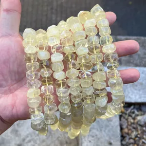 Detailed close-up view of faceted natural yellow crystal beads for DIY jewelry making projects