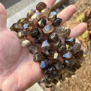 Close-up of translucent smoky quartz faceted irregular barrel beads for DIY jewelry