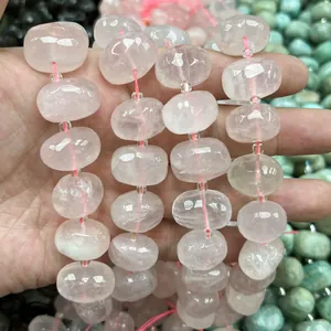 Close-up view of natural pink rose quartz oval faceted candy beads for DIY jewelry making