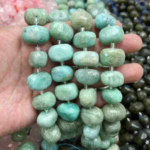Macro detail of faceted natural oval amazonite stone beads for DIY jewelry making projects