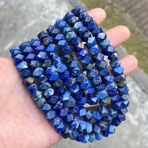 Detailed view of natural blue lapis lazuli faceted beads for DIY jewelry making.