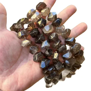 Natural faceted smoky quartz gemstone beads for DIY jewelry making shown on hand