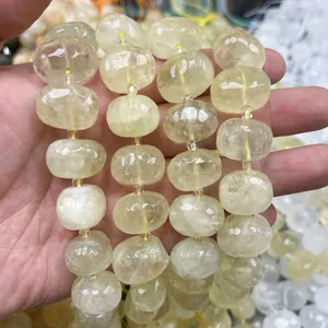 Detailed macro view of faceted oval yellow crystal beads for handmade jewelry crafts