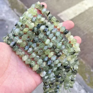 Detail view of faceted natural light green crystal beads for DIY jewelry accessories