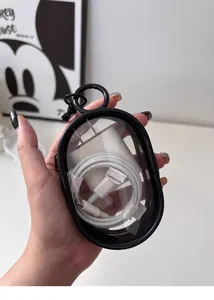 Portable transparent storage case showing charger and cable inside