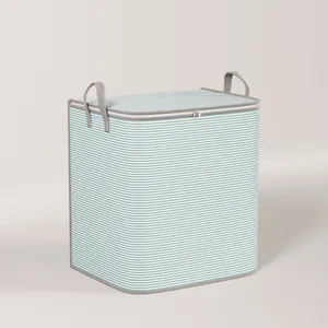 Large teal and white striped storage bag with gray handles for bedding and clothes