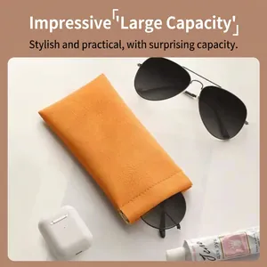 Orange leather sunglasses pouch with automatic closure and soft lining